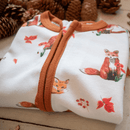Grow Grows Organic Fluffy Foxes Sleepsuit folded beautifully next to pine cones | Baby Grows and Onesies | Organic Baby Clothes - Clair de Lune UK