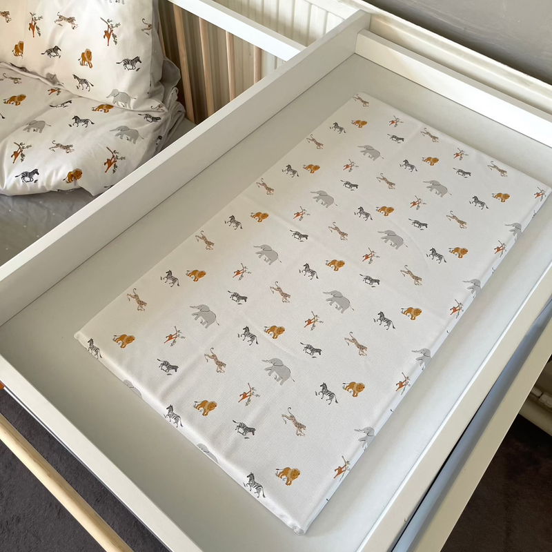 Jungle Dream Folding Changing Mat on the Essentials Cot Top Changer | Baby Bath Time Essentials - Clair de Lune UK