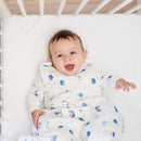 Baby wearing the Grow Grows Marvellous Moons Smart Sleeping Bag in the cot | Baby Sleeping Bags | Baby Bedding - Clair de Lune UK