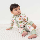 Toddler relaxing on the floor wearing the GrowGrows Organic Woodland Walks Sleepsuit | Baby Grows and Onesies | Organic Baby Clothes - Clair de Lune UK