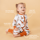 Toddler girl wearing the GrowGrows Organic Gentle Giraffes Sleepsuit key features | Baby Grows and Onesies | Organic Baby Clothes - Clair de Lune UK