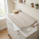 Gingham Anti-Roll Wedge Changing Mat on a white changing unit with white muslin cloth underneath | Bathing and Changing Essentials - Clair de Lune UK