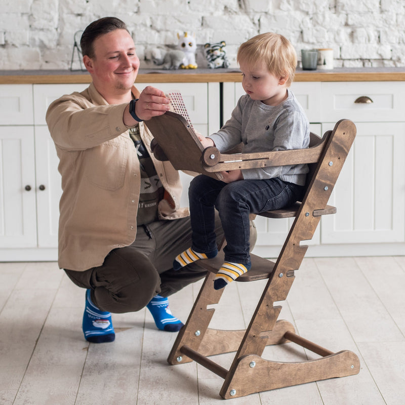 Dad teaching a boy sitting on the Natural Goodevas 3in1 Highchair with Adjustable Tabletop | Highchairs | Feeding & Weaning - Clair de Lune UK