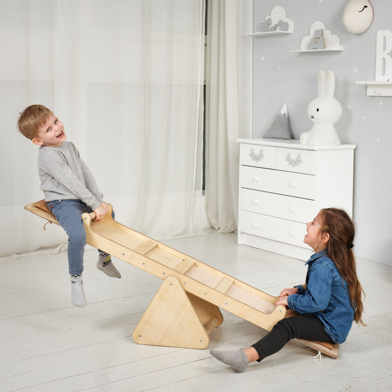 Two kids having fun playing the Goodevas Montessori Wooden Seesaw | Montessori Activities For Babies & Kids - Clair de Lune UK