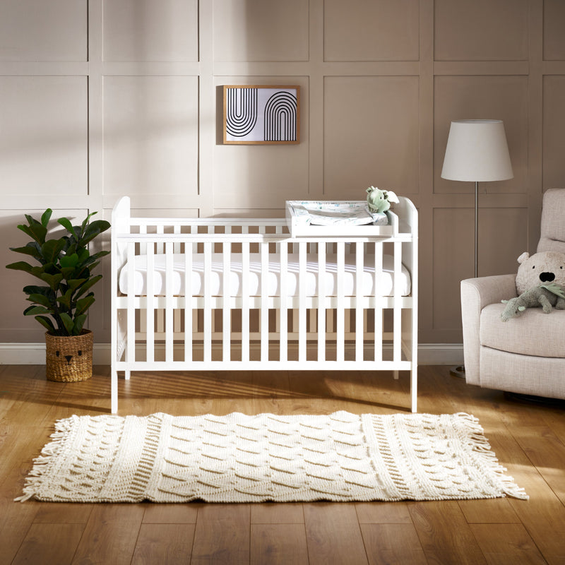 White Obaby Cot/Cot Bed Top Changer on the white cot | Baby Changing Units, Tables & Cot Top Changers | Baby Bath Time - Clair de Lune UK