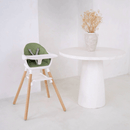 Green 6in1 High Chair in an ultra stylish white home next to a white dining table with textured vase with dry flowers | High chairs | Feeding & Weaning | Toddler Furniture - Clair de Lune UK