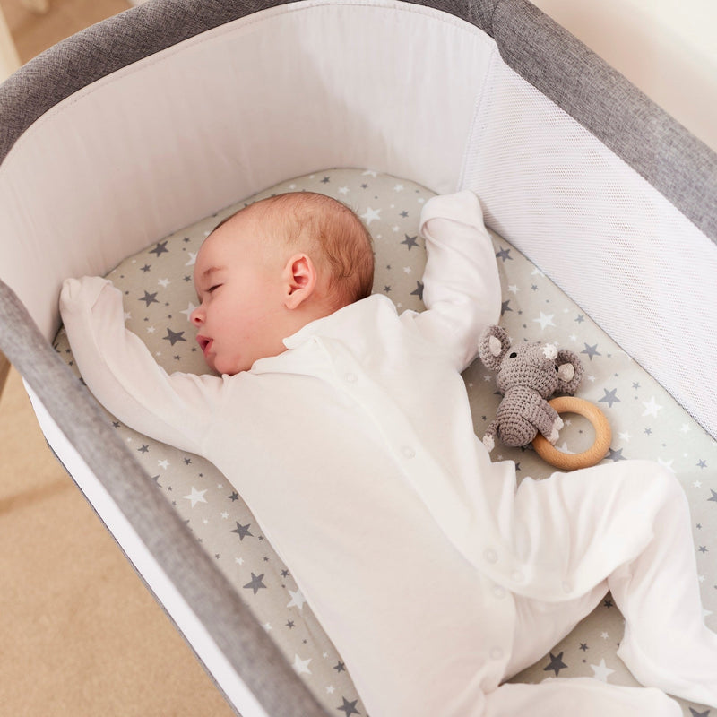 Baby sleeping in the Ickle Bubba Drift Gliding Crib | Bedside & Folding Cribs | Co-sleepers | Nursery Furniture - Clair de Lune UK