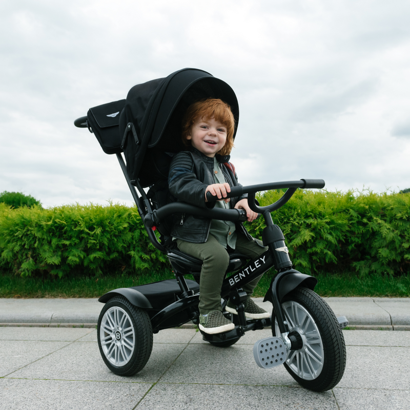 Little boy riding his Onyx Black Bentley 6in1 Trike - Convertible Baby Stroller | Strollers, Pushchairs & Prams | Pushchairs, Carrycots & Car Seats Baby | Travel Essentials - Clair de Lune UK