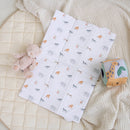 Jungle Dream Folding Travel Changing Mat view from above laid out on floor with rattle and baby toys | Baby Change Mats | Baby Bath Time Essentials - Clair de Lune UK