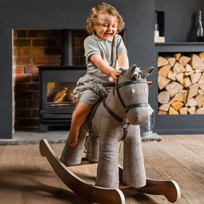 Toddler boy loving his Christmas gift and birthday gift Little Bird Told Me Jasper Rocking Horse | Rocking Animals | Montessori Activities For Babies & Kids | Toys | Baby Shower, Birthday & Christmas - Clair de Lune UK