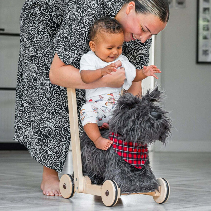 Mum helping baby getting into his favourite toy Little Bird Told Me Scottie Dog 2in1 Push Along, Baby Walker and Ride On | Baby Walkers and Ride On Toys | Montessori Activities For Babies & Kids | Toys | Baby Shower, Birthday & Christmas Gif
