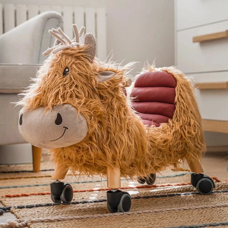 Little Bird Told Me Hubert Highland Cow Ride On Toy in a natural Scandi nursery | Baby Walkers and Ride On Toys | Montessori Activities For Babies & Kids | Toys | Baby Shower, Birthday & Christmas Gifts - Clair de Lune UK
