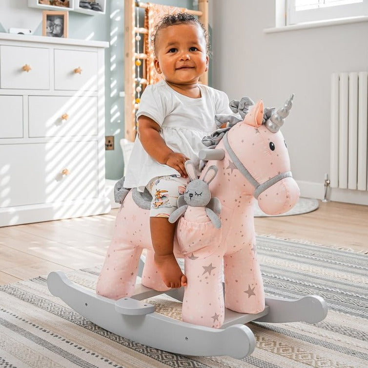 Toddler having fun riding her favourite pink Little Bird Told Me Celeste & Fae Rocking Unicorn | Rocking Animals | Montessori Activities For Babies & Kids | Toys | Baby Shower, Birthday & Christmas - Clair de Lune UK