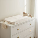 East Coast Little and Loved Changing Mat on a white dresser in a white nursery by a bright window | Bathing & Changing Essentials - Clair de Lune UK