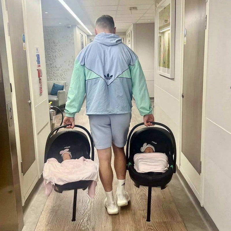 Dad carrying babies in My Babiie iSize Infant Carrier and isofix base (40-87cm) | Baby, Toddler & Kid Car Seats | Travel With Baby - Clair de Lune UK