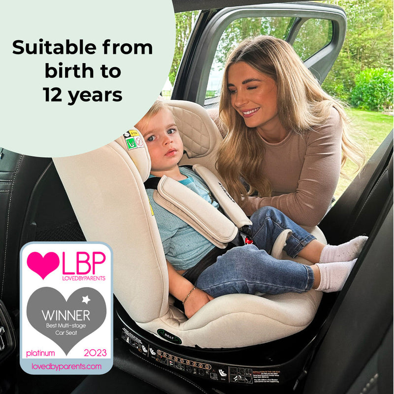 Dani Dayer next to her son sitting on the My Babiie Dani Dyer iSize Stone Spin Car Seat (40-150cm) | Baby, Toddler & Kid Car Seats | Travel With Baby - Clair de Lune UK