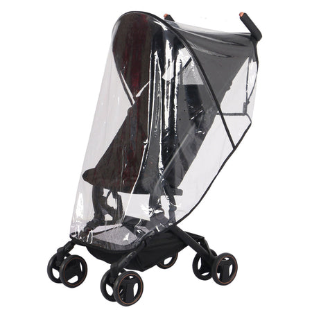 Folded Dani Dayer pusing her baby in My Babiie MBX5 Ultra Compact & Aeroplane Carry-on Approved Black Chevron Stroller with the raincover | Buggies, Strollers & Pushchairs | Travel With Your Baby - Clair de Lune UK