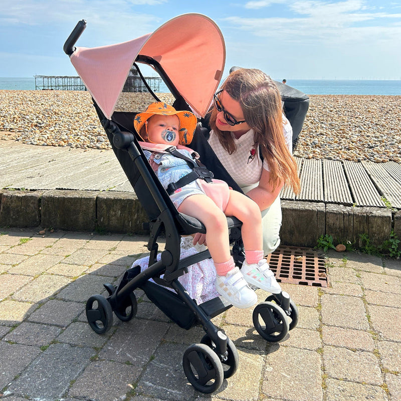 Mom next to her baby in My Babiie MBX5 Ultra Compact & Aeroplane Carry-on Approved Billie Faiers Pink Stroller | Buggies, Strollers & Pushchairs | Travel With Your Baby - Clair de Lune UK