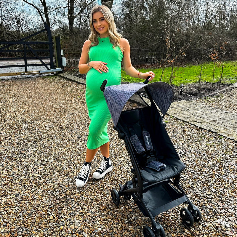 Dani Dayer next to her baby's stroller - My Babiie MBX5 Ultra Compact & Aeroplane Carry-on Approved Black Chevron Stroller | Buggies, Strollers & Pushchairs | Travel With Your Baby - Clair de Lune UK