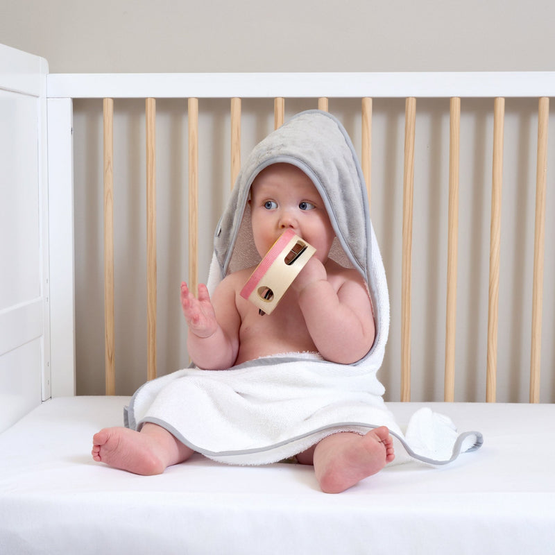 Baby in the Cot wearing the Grey Marshmallow Hooded Towel | Baby Bathing & Changing Essentials - Clair de Lune UK