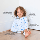 Toddler sat smiling wearing the Grow Grows Organic Marvellous Moons Sleepsuit with key features | Baby Grows and Onesies | Organic Baby Clothes - Clair de Lune UK