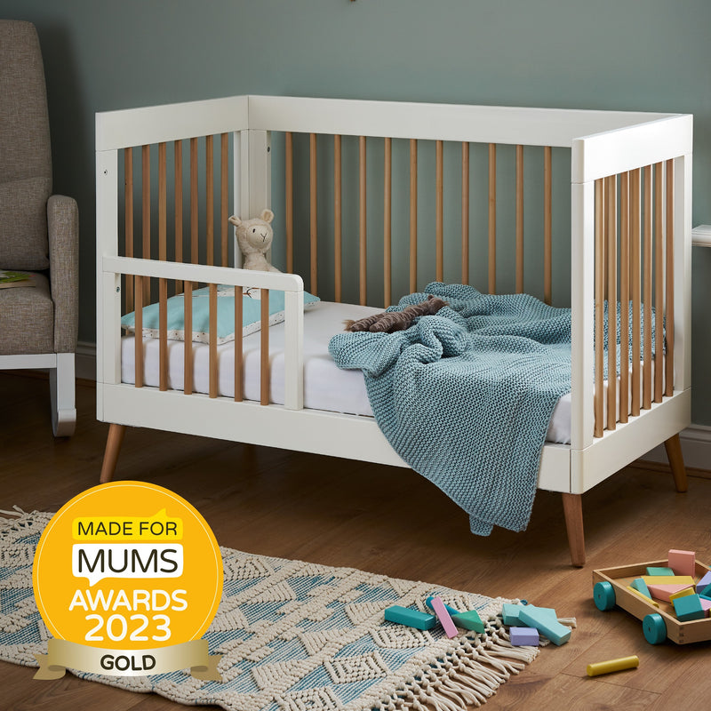 The toddler bed transformation of the White Natural Obaby Award-Winning Maya Mini Cot Bed with the toddler rail | Cots, Cot Beds, Toddler & Kid Beds | Nursery Furniture - Clair de Lune UK
