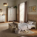 Cashmere CuddleCo Clara Luxe 3 Piece Furniture Set in a cosy, warm nursery with a focus on the Clara Cot Bed converted to a toddler bed | Cot Bed, Wardrobe, Changer | Nursery Furniture - Clair de Lune UK