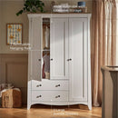 White/Ash CuddleCo Clara Luxe 3 Piece Furniture Set in a cosy, warm nursery - Key features of the 3 door wardrobe with lots of storage, 2 removable hanging rails and large bottom drawers | Cot Bed, Wardrobe, Changer | Nursery Furniture - Clair de Lune UK