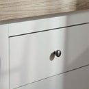 White CuddleCo Clara Luxe 2 Piece Furniture Set - close up on the handles of the Changer Dresser in a cosy beige and brown nursery | Nursery Furniture - Clair de Lune UK