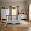 White/Ash CuddleCo Clara Luxe 3 Piece Furniture Set in a cosy, warm nursery | Cot Bed, Wardrobe, Changer | Nursery Furniture - Clair de Lune UK