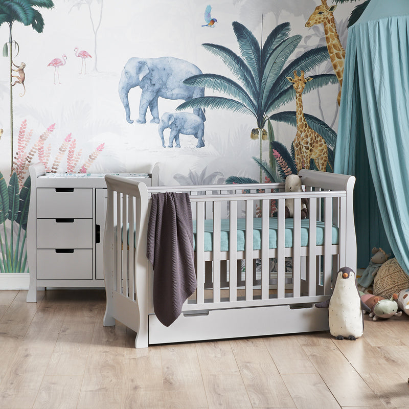 The warm grey Obaby Stamford Mini Sleigh Cot & Changing Unit in a jungle dream nursery room | Nursery Furniture Sets | Room Sets | Nursery Furniture - Clair de Lune UK