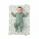 Baby lying on the Olive Foldable Travel Changing Mat laid out flat | Baby Change Mat | Bathing & Changing Essentials - Clair de Lune UK