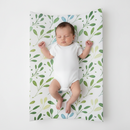 Baby Sleeping on the Olive Anti-Roll Wedge Baby Changing Mat profile on a white background | Baby Bath Time Essentials - Clair de Lune UK