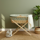 Gold Award Winning Sage Organic Natural Wicker Moses Basket in the nursery next to a large floor plant | Moses Baskets | Co-sleepers | Nursery Furniture - Clair de Lune UK