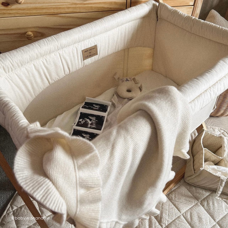 Cream Organic Folding Crib with the setup for a pregnancy announcement | Bedside Cribs & Folding Cribs | Next To Me Cots & Newborn Baby Beds | Co-sleepers - Clair de Lune UK