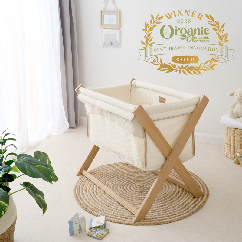 Cream Organic Folding Crib in a Nordic Japanese nursery with the Organic Baby Awards Gold Winner logo | Bedside Cribs & Folding Cribs | Next To Me Cots & Newborn Baby Beds | Co-sleepers - Clair de Lune UK
