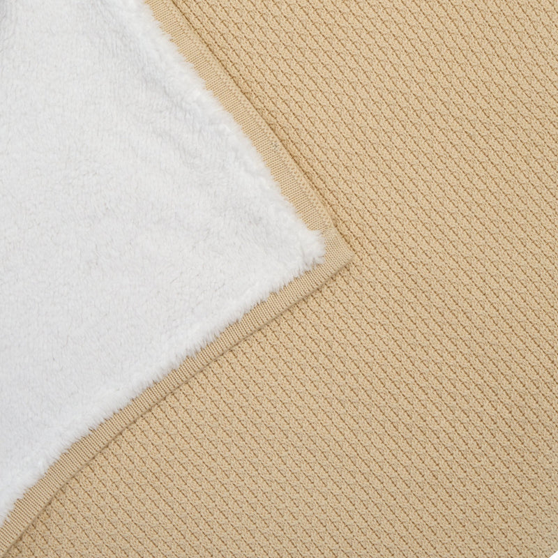 Close up of the Organic Knit Sherpa Blanket in Cream with the corner folded over to see the cosy plush fleece | Cosy Baby Blankets | Swaddles | Baby Winter Warmers - Clair de Lune UK