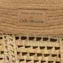 Close up of the biscuit brown Organic Knitted Moses Basket Dressing | Moses Baby Basket Bedding | Nursery Linen - Clair de Lune UK