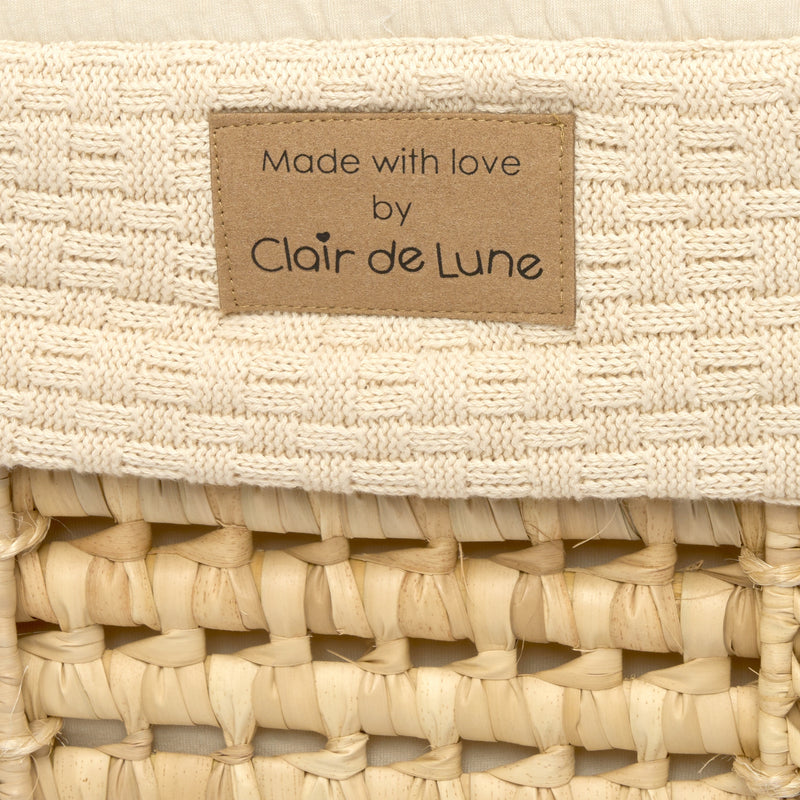 Close up of the vegan faux leather Made with Love label on the Cream Organic Knitted Palm Moses Basket | Moses Baby Baskets, Bassinets | Organic Baby Essentials | Nursery Furniture - Clair de Lune UK