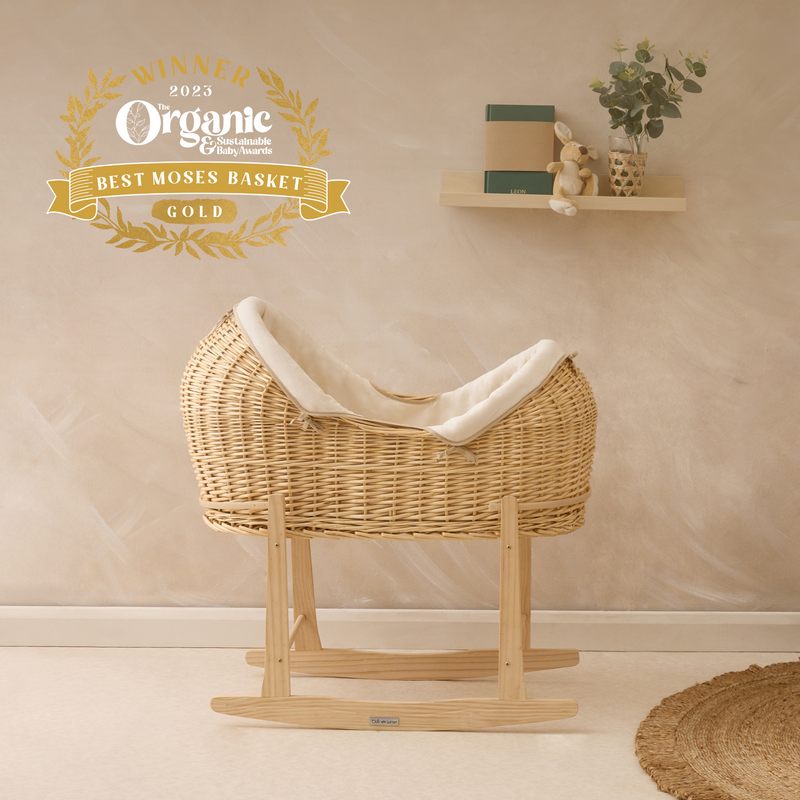 Cream Organic Natural Noah Pod on the Natural Standard Rocking Stand in a creamy nursery with the Organic Baby Awards Gold Winner logo | Bassinets | Nursery Furniture - Clair de Lune UK