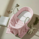 Pink Fleece Palm Moses Basket Bundle including cellular shawl and mattress on a stylish flat lay | Moses Baby Baskets and Bassinets - Clair de Lune UK