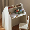 CuddleCo Play House Storage Desk with Easel and Chair in cosy nursery with drawing supplies and colouring books close up on the desk with mini shelf | Toddler Desk and Chair | Nursery Furniture - Clair de Lune UK