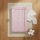 Flat lay of the East Coast Pink Posie Changing Mat on an oak floor with white muslin and nappies | Bathing & Changing Essentials - Clair de Lune UK
