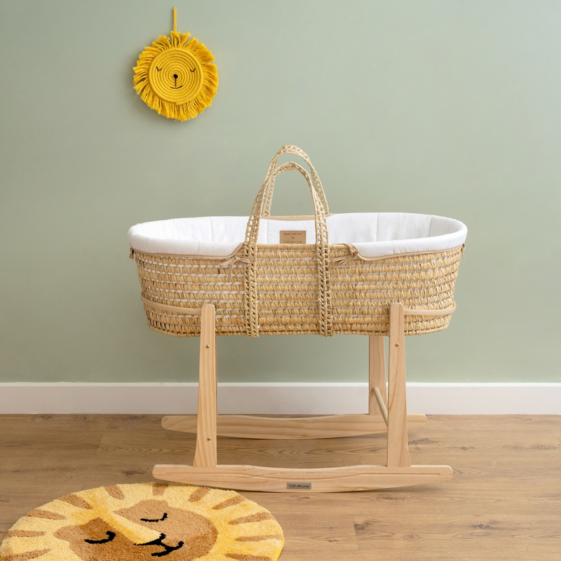 The White Organic Palm Moses basket on the standard natural rocking stand in a sage green nursery| Moses Basket Stand | Moses Baby Baskets & Bassinet Accessories | Nursery Furniture - Clair de Lune UK