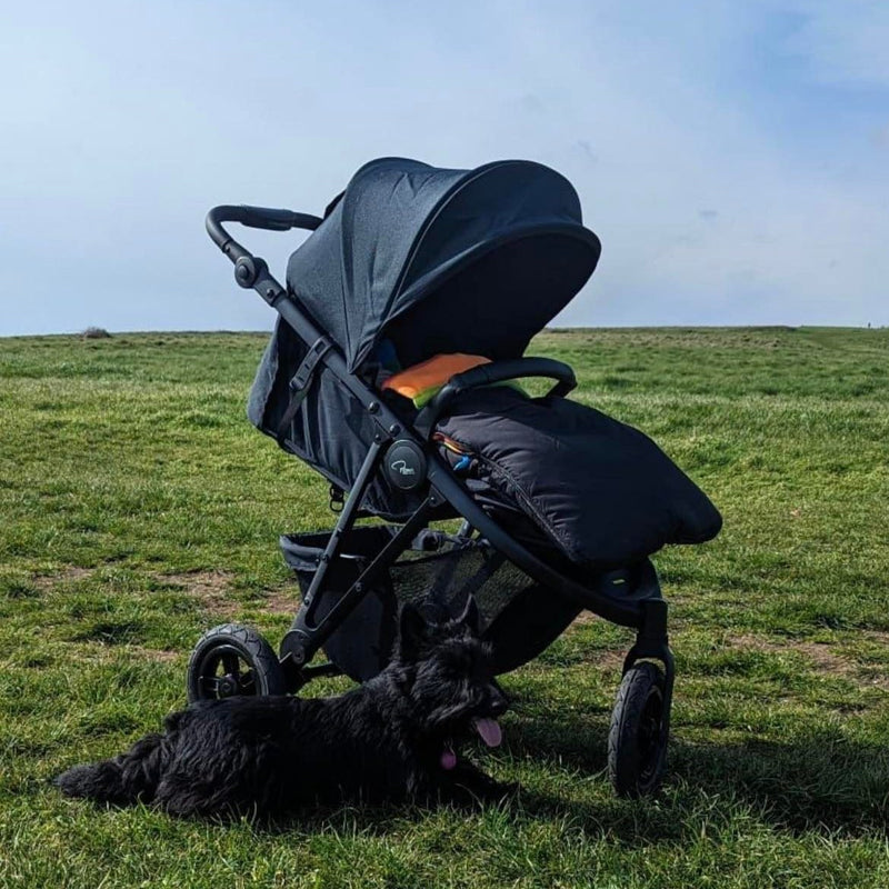 Jet Black Roma Atlas 3 Wheel Pram in a field in an English countryside | Strollers, Pushchairs & Prams | Pushchairs, Carrycots & Car Seats Baby | Travel Essentials - Clair de Lune UK