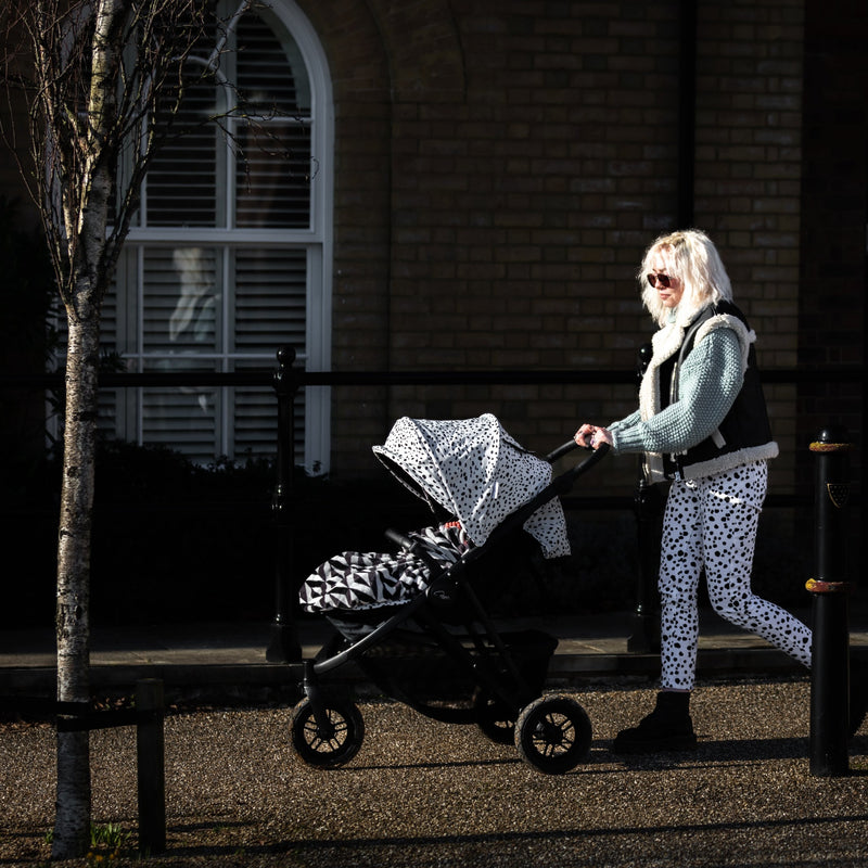 Mum walking her kid with the Dalmatian Roma Atlas 3 Wheel Pram | Strollers, Pushchairs & Prams | Pushchairs, Carrycots & Car Seats Baby | Travel Essentials - Clair de Lune UK