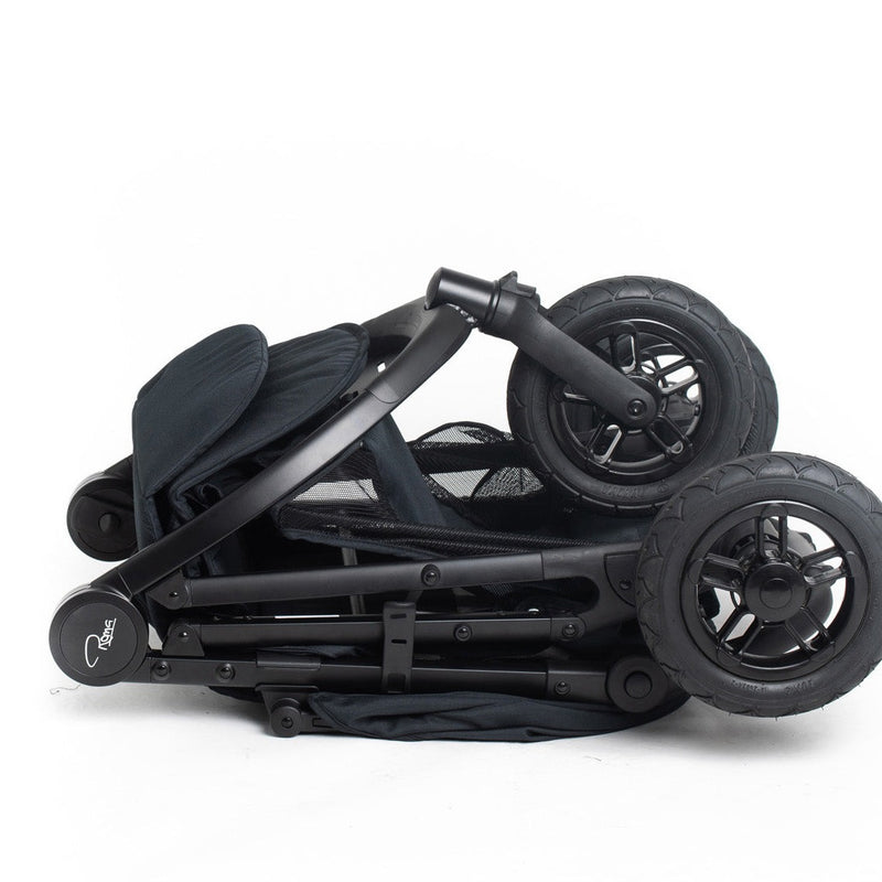 Folded Jet Black Roma Atlas 3 Wheel Pram on the floor | Strollers, Pushchairs & Prams | Pushchairs, Carrycots & Car Seats Baby | Travel Essentials - Clair de Lune UK