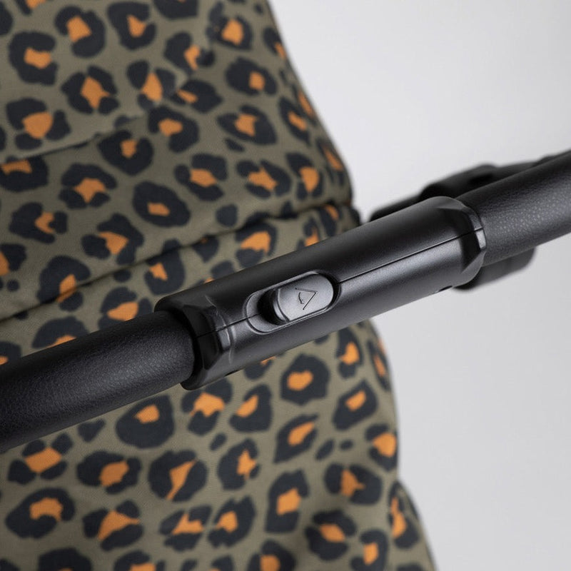 The pushchair handle of the of the Khaki Leopard Roma Atlas 3 Wheel Pram | Strollers, Pushchairs & Prams | Pushchairs, Carrycots & Car Seats Baby | Travel Essentials - Clair de Lune UK