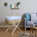 Blue Stripe Palm Moses Basket on Natural Folding Stand in living room | Moses Baby Baskets, Bassinets | Nursery Furniture - Clair de Lune UK