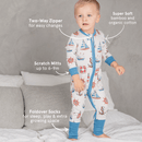 Toddler standing on the bed wearing the GrowGrows Organic Seaside Sailor Sleepsuit with key features | Baby Grows and Onesies | Organic Baby Clothes - Clair de Lune UK